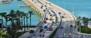 <p>A photo of a waterfront highway. The image includes overlays simulating how AdMobilize identifies different vehicles.</p>
