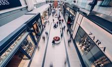 An aerial view of a mall floor. People are blurred, implying that they are walking. Though their demographics may be recorded, no personal information will be.