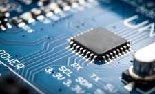 A chip on a circuit board. This chip represents an idea of what SoC chips might look like inside of an SoC digital signage display