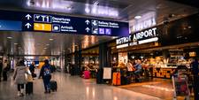 People walking through an airport