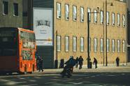 A digital display on the side of a building. On the screen are two pillows, one with the letter K written on it and the other with the letter T. It's a part of the Eve Sleep custom pillows campaign.