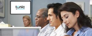 <p>Three people sitting in a waiting room. A Tonic Health Media image is in the background.</p>
