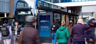 <p>A Clear Channel display by a bus terminal. This and other displays in Clear Channel’s network are now available to transact on programmatically via Broadsign Reach.</p>
